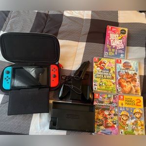 Nintendo Switch - Includes 5 games, Carry-on bag, Cables for dock are included